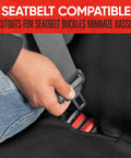 Person securing seatbelt on waterproof neoprene rear bench seat cover for cars trucks SUVs and vans 100 percent back seat protector against spills messes dog hair mud and kids universal fit with buckle cutouts.