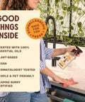 Person cleaning kitchen countertop with Granite And Stone Daily Countertop Cleaner With Plant Based Formula, bright lemon scent.