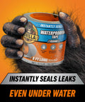 Gorilla holding Clear Waterproof Patch And Seal Tape 4 Inch By 8 Foot Pack Of 4 For Permanent Weatherproof Seals On Leaks And Repairs