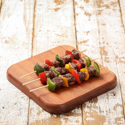 Three colorful kebabs on 200 Pack Bamboo Skewers 12 Inch Wooden Kabob Sticks For Appetizers And Grilling served on a wooden board
