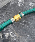Green garden hose with aluminum connector and clamps on rock surface, Four Pack Aluminum Garden Hose Repair Connectors Set With Clamps