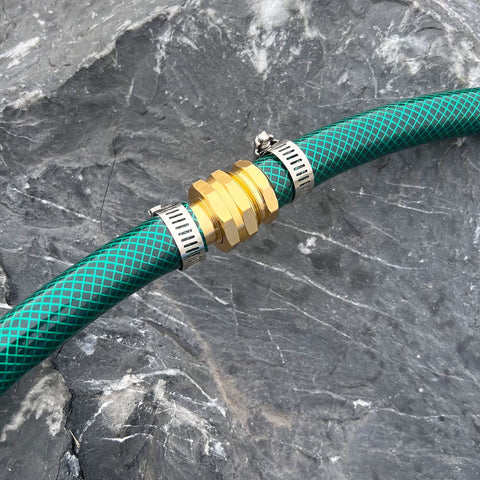 Green garden hose with aluminum connector and clamps on rock surface, Four Pack Aluminum Garden Hose Repair Connectors Set With Clamps