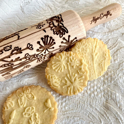 Mini Embossed Rolling Pin Set Of 3 With Bees, Meadow And Forest Patterns for cookies, made of beech wood, shown with embossed cookies.