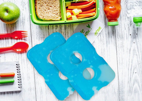 Slim Reusable Ice Packs For Coolers And Lunch Boxes Set Of 4 Long Lasting Freezer Packs on a table with lunch items