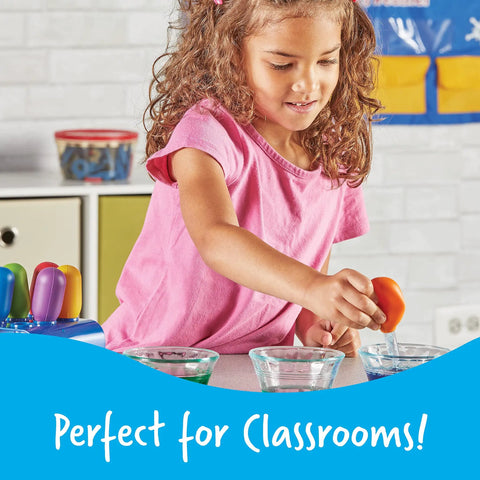Child using Big Grip Eyedroppers For Kids Easy Squeeze Jumbo Droppers for hands-on science fun with colorful liquids in classroom setting.