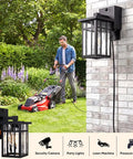 Heavy Duty Matte Black Motion Sensor Outdoor Wall Light With Built In GFCI Outlet next to a man mowing the lawn.