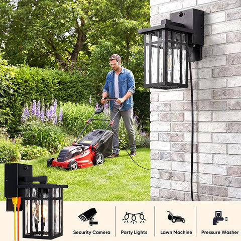 Heavy Duty Matte Black Motion Sensor Outdoor Wall Light With Built In GFCI Outlet next to a man mowing the lawn.