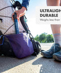 Person placing Personal Water Purifier For Hiking Camping Travel And Emergency Prep Delivers Safe Drinking Water into backpack pocket