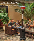 50,000 BTU Outdoor Patio Heater With Round Table Design in use on a patio with people seated around it, black color, ETL Certified.