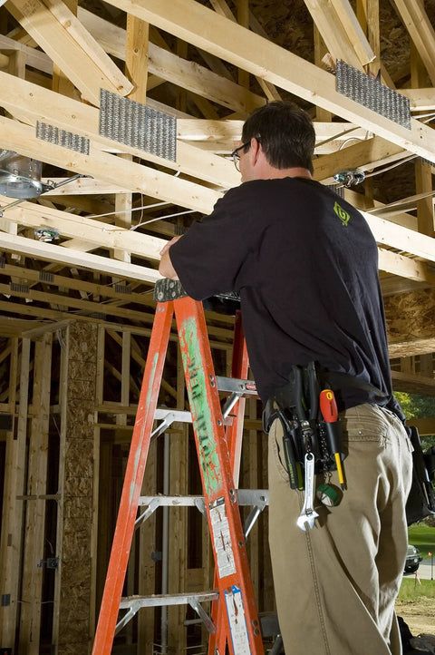 Construction worker on ladder using Leather Four Pocket Tool Pouch For Belt Holster in wooden building frame