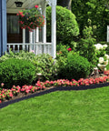 148 Ft Garden Landscape Edging Kit With 4 Inch Tall Border Easy Install DIY Friendly Includes 70 Spiral Anchors And 20 Connectors Black Border Roll defining a flower bed by a porch