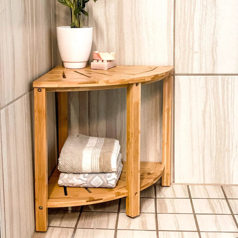 Corner Bamboo Shower Bench With Storage Shelf, 2 Tier Wood Seat, Non Slip Feet in bathroom corner with towels and plant