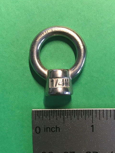 Close-up of 1/4 inch marine grade stainless steel lifting eye nut with ruler, AISI 316 corrosion resistant heavy duty eyebolt.