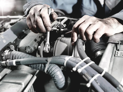 Mechanic using Compact 28 Piece Zyklop Metric Ratchet Set With One Quarter Inch Drive Switch Lever Ultra Slim Metal Ratchets on engine