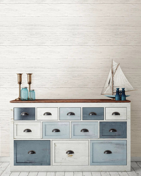 White shiplap peel and stick wallpaper behind a multi-colored drawer unit, Shiplap Peel And Stick Wallpaper White And Off White Removable Easy DIY Wall Decor For Rentals And Home Refresh No Residue Easy To Remove And Repositionable For Accent Walls And Renter Friendly Updates Across Living Areas
