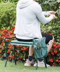 Person using Folding Garden Kneeler Bench Knee Saver With Heavy Duty Build And EVA Foam Pad Dual Purpose Kneeler And Seat in garden