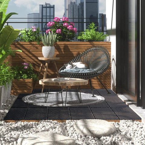 Interlocking Deck Tiles 27 Pack Outdoor Flooring 12 By 12 Inch Plastic Tiles DIY Friendly All Weather Waterproof Patio Pavers For Balcony Decor Porch Poolside Backyard Brown Non Slip Easy Install on balcony with plants and chair