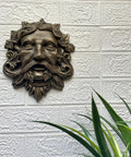 Top Tier Green Man Wall Decor, Slick 9.75 Inch Heavy Duty Cast Iron Plaque, Solid Bronze Finish, wall-mounted decoration with foliage.