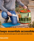 5 Gal Garden Tool Bucket Caddy With Nine Deep Pockets And Pencil Slots Durable Canvas Organizer in use outdoors, holding tools.
