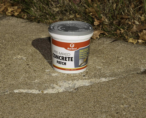 Premixed Concrete Repair Patch For Cracks And Breaks, 1 Quart Gray Cement Crack Filler That Won't Shrink Or Crack, Interior And Exterior Use, Dries Light To Medium Gray, Easy Water Cleanup on a cracked path