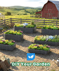 Farmyard with multiple oval galvanized raised garden bed kits with strengthened crossbars, planted with vegetables and flowers.