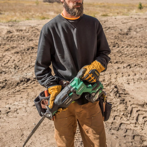 Person holding a power tool with Beefy MultiVolt 18V And 36V Lithium Battery Pack With 8.0Ah For 18V Tools And 4.0Ah For 36V Tools