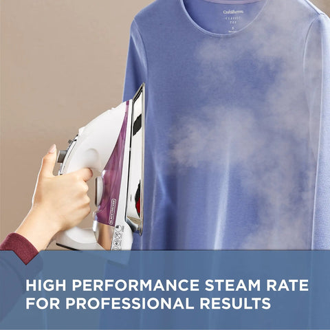 Hand using Pro Grade Steam Iron With Stainless Steel Soleplate Extra Long Cord AntiDrip Tech Auto Clean System Variable Steam And Temperature Controls Purple Finish For Fast Smooth Garment Touchups on blue shirt