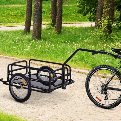 Foldable Bike Cargo Trailer With Hitch Tow-Behind Wagon, 88 Lb Capacity, Black Utility Cart attached to a bicycle on a path