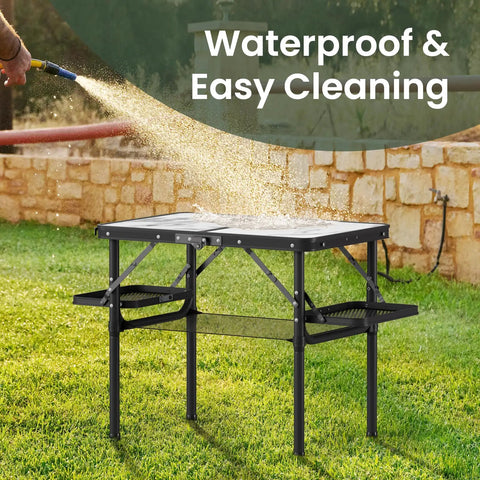 Compact Foldable Camping Table Two Foot For Picnic Portable Beach Table With Side Racks And Net being cleaned with water