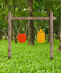 AR500 Steel Target With Gong Mounting Kit And Neon Color Hostage Target for outdoor range shooting in a forest setting.
