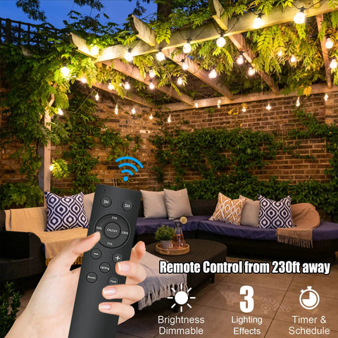 Hand holding remote with 100-Foot Outdoor String Lights With 54 Shatterproof Edison S14 Bulbs on patio pergola backdrop
