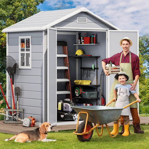 Sturdy 6x4.4 Ft Outdoor Resin Storage Shed With Reinforced Floor Lockable Door Window And Vent All Weather Bike And Tool Storage For Garden Backyard Patio And Lawn with tools inside, child in front with wheelbarrow, and dog on grass.