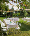 Outdoor event setup with Ten Pack White Plastic Folding Chairs With Steel Frame Indoor Outdoor Portable Stackable Commercial Seating