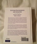 Back cover of a white book: Systems Engineering and Analysis, Fifth Edition by Blanchard and Fabrycky; Pearson imprint.