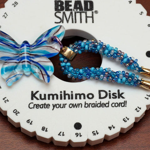 Round Kumihimo Disk Set For Jewelry Making, 6 Inch Diameter Dense Foam, Three-Eighth Inch Thick, with blue beaded braid.