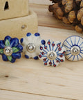 Colorful Blue Ceramic Cabinet Knobs Set Of 25 For Kitchen Cabinets, blue and white pottery knobs on wood surface