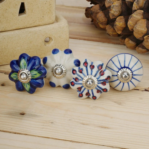 Colorful Blue Ceramic Cabinet Knobs Set Of 25 For Kitchen Cabinets, blue and white pottery knobs on wood surface