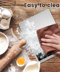 Hand cleaning Dope Digital Kitchen Scale with USB charging, waterproof stainless steel surface, precise 0.1oz to 33lb range, LCD readout.