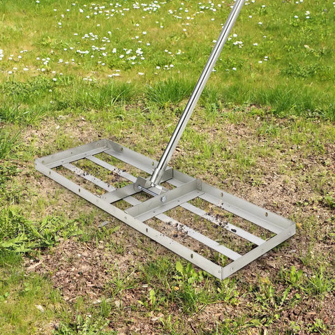 30 By 10 Inch Stainless Steel Lawn Leveling Rake With 6-Foot Extra Long Handle in use on grass.