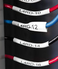 Close-up of wires labeled with Rhino 5200 Label Maker With One Touch Hot Keys For Speedy, Durable Asset Labeling On Job Sites
