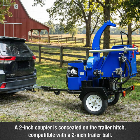 Blue 8 Inch Gas Powered Hydraulic Feeding Wood Chipper Shredder Towable With Tow Bar Electric Start behind a car on a farm