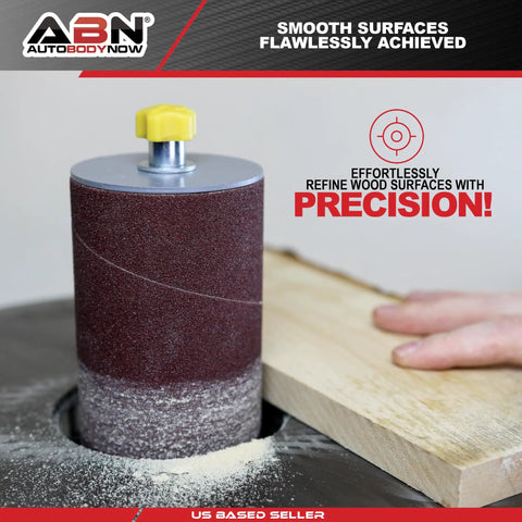 Person using Aluminum Oxide Spindle Sanding Sleeves 18 Pack 4.5 Inch Length Assorted Grits 80 120 240 to smooth wood on a sander.