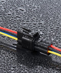 4 Pin Waterproof Car Wiring Connector Kit With 10Cm 16AWG Copper Wire Quick Disconnect with water droplets showing weatherproof use