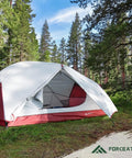 Two Person Waterproof And Windproof Camping Tent in forest setting, showing aluminum poles and open dual D-shaped doors