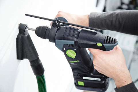 Drilling Dust Nozzle With Built In Metric Scale For CT Vac Systems, 27 mm Hose Compatible, in use during drilling on a wall.