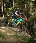 Cyclist riding mountain bike on trail with Flat Bar MTB Stem Mount For A Clean Cockpit One Accessory At A Time Mount A Computer Camera