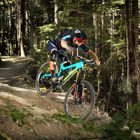 Cyclist riding mountain bike on trail with Flat Bar MTB Stem Mount For A Clean Cockpit One Accessory At A Time Mount A Computer Camera