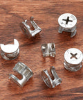 80Pcs Furniture Cam Lock Connectors Set For Cabinets And Drawers Zinc Alloy Cam Lock Nuts on wood surface, multiple sizes visible.