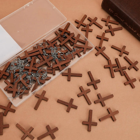 Hella Sturdy Wooden Cross Charms Bulk Pack Of Sixty Pocket Size Beads With Pre Drilled Hole For DIY Necklace Projects And Religious Craft Supplies Top Shelf Quality in a clear box.