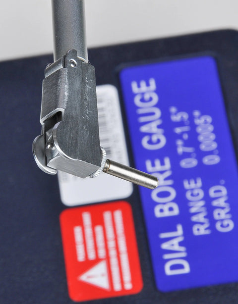 Close-up of Fowler 52-646-100-0 dial bore gauge set with 0.7–1.5 in range and metal probe.